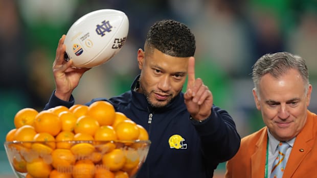 Notre Dame Fighting Irish head coach Marcus Freeman celebrates defeating the Penn State Nittany Lions  in the Orange Bowl.