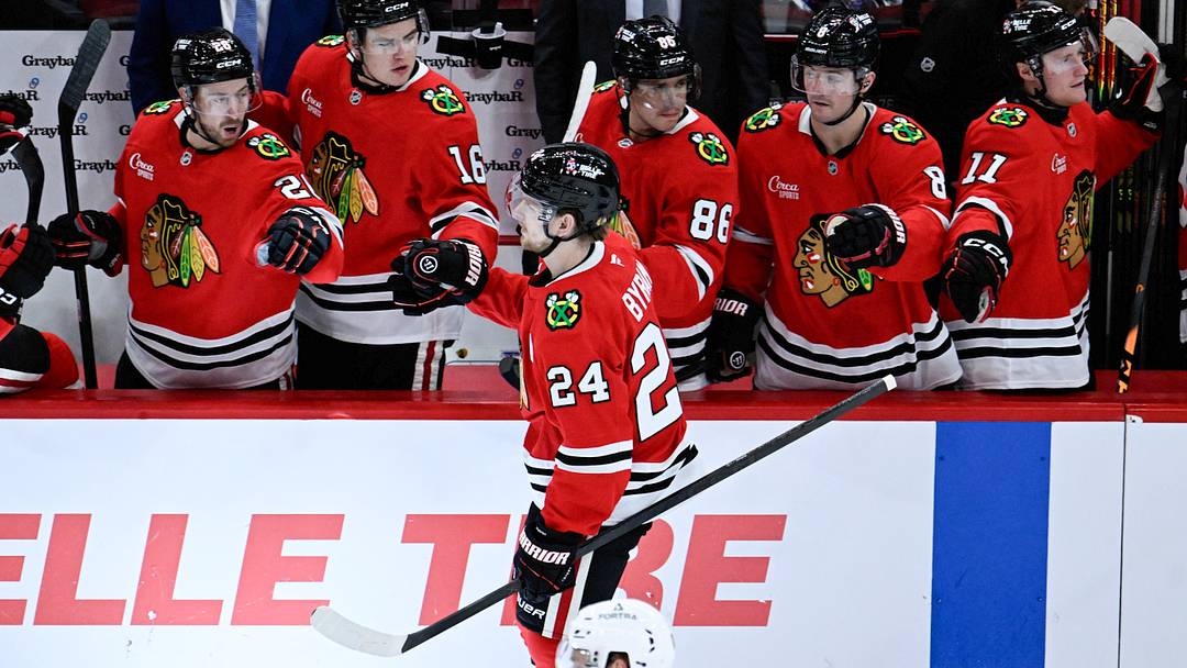 Sep 21, 2026; Chicago, Illinois, USA;  Chicago Blackhawks defenseman Bowen Byram (24)  celebrates with teammates after scoring a goal during the second period against the Minnesota Wild at the United Center.  Mandatory Credit: Matt Marton-Imagn Images
