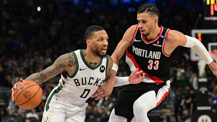 Jan 4, 2025; Milwaukee, Wisconsin, USA; Milwaukee Bucks guard Damian Lillard (0) drives for the basket against Portland Trail Blazers forward Toumani Camara (33) in the third quarter at Fiserv Forum. Mandatory Credit: Benny Sieu-Imagn Images Jan 4, 2025; Milwaukee, Wisconsin, USA; Milwaukee Bucks guard Damian Lillard (0) drives for the basket against Portland Trail Blazers forward Toumani Camara (33) in the third quarter at Fiserv Forum. Mandatory Credit: Benny Sieu-Imagn Images