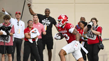 Oct 18, 2025; Bloomington, Indiana, USA; Indiana Hoosiers wide receiver Elijah Sarratt (13) runs after a catch for a touchdown during the first half against the Michigan State Spartans at Memorial Stadium. Mandatory Credit: Robert Goddin-Imagn Images