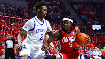 Feb 4, 2025; Oxford, Mississippi, USA; Mississippi Rebels guard Jaylen Murray (5) drives to the basket as Kentucky Wildcats guard Jaxson Robinson (2) defends during the second half at The Sandy and John Black Pavilion at Ole Miss. Mandatory Credit: Petre Thomas-Imagn Images