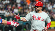 Sep 20, 2025; Phoenix, Arizona, USA; Philadelphia Phillies outfielder Kyle Schwarber (12) celebrates after scoring a run against the Arizona Diamondbacks during the first inning at Chase Field. Mandatory Credit: Joe Camporeale-Imagn Images