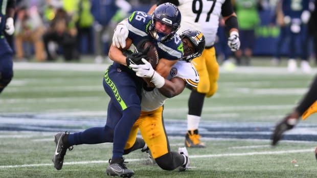 Pittsburgh Steelers linebacker Myles Jack (16) tackles Seattle Seahawks running back Zach Charbonnet (26).