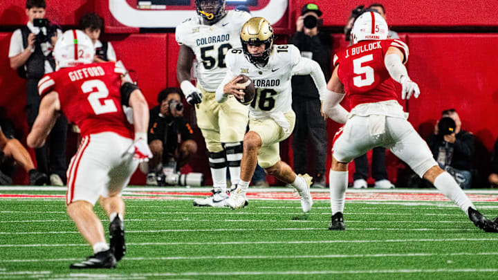 Sep 7, 2024; Lincoln, Nebraska, USA; Colorado Buffaloes quarterback Ryan Staub (16) runs against Nebraska Cornhuskers linebacker John Bullock (5) during the fourth quarter at Memorial Stadium. 