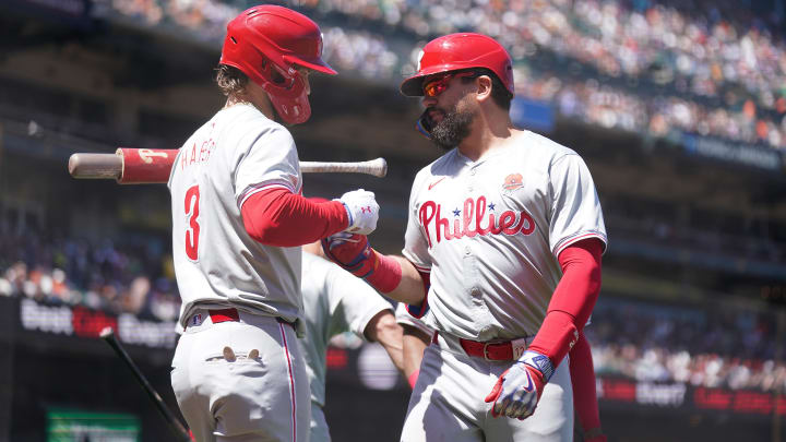May 27, 2024; San Francisco, California, USA; Philadelphia Phillies designated hitter Kyle Schwarber (12) is congratulated by first baseman Bryce Harper (3) after hitting a home run against the San Francisco Giants in the third inning at Oracle Park. Mandatory Credit: Cary Edmondson-USA TODAY Sports