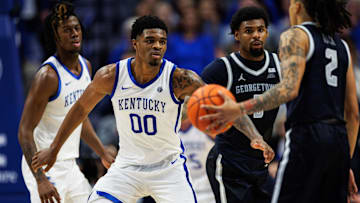 Oct 30, 2025; Lexington, KY, USA; Kentucky Wildcats guard Otega Oweh (00) defends against Georgetown Hoyas guard Malik Mack (2) during the second half at Rupp Arena at Central Bank Center. Mandatory Credit: Jordan Prather-Imagn Images