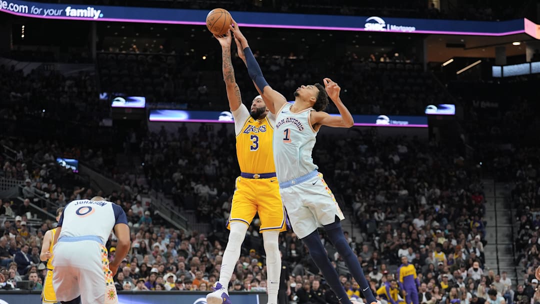 Nov 27, 2024; San Antonio, Texas, USA;  San Antonio Spurs center Victor Wembanyama (1) blocks a shot by Los Angeles Lakers forward Anthony Davis (3) in the second half at Frost Bank Center. Mandatory Credit: Daniel Dunn-Imagn Images