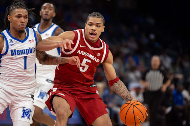 Arkansas Razorbacks guard Darius Acuff Jr. (5) handles the ball