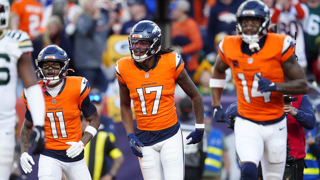 Dec 14, 2025; Denver, Colorado, USA; Denver Broncos wide receiver Lil'Jordan Humphrey (17) celebrates a touchdown with wide receiver Troy Franklin (11) and wide receiver Courtland Sutton (14) during the second quarter against the Green Bay Packers at Empower Field at Mile High. Mandatory Credit: Ron Chenoy-Imagn Images