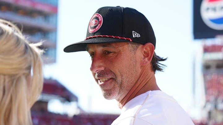 Sep 9, 2024; Santa Clara, California, USA;  San Francisco 49ers head coach Kyle Shanahan chats with a reporter before a game against the New York Jets at Levi's Stadium. Mandatory Credit: David Gonzales-Imagn Images