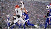 Cincinnati Bengals wide receiver Ja'Marr Chase (1) leaps fo a catch in the zone as Buffalo Bills linebacker Matt Milano (58) defends in the second quarter during an NFL divisional playoff football game between the Cincinnati Bengals and the Buffalo Bills, Sunday, Jan. 22, 2023, at Highmark Stadium in Orchard Park, N.Y. The catch was ruled incomplete upon further review.
