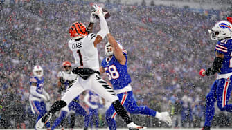 Cincinnati Bengals wide receiver Ja'Marr Chase (1) leaps fo a catch in the zone as Buffalo Bills linebacker Matt Milano (58) defends in the second quarter during an NFL divisional playoff football game between the Cincinnati Bengals and the Buffalo Bills, Sunday, Jan. 22, 2023, at Highmark Stadium in Orchard Park, N.Y. The catch was ruled incomplete upon further review.