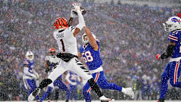 Cincinnati Bengals wide receiver Ja'Marr Chase (1) leaps fo a catch in the zone as Buffalo Bills linebacker Matt Milano (58) defends in the second quarter during an NFL divisional playoff football game between the Cincinnati Bengals and the Buffalo Bills, Sunday, Jan. 22, 2023, at Highmark Stadium in Orchard Park, N.Y. The catch was ruled incomplete upon further review.