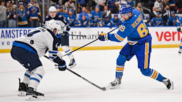 Feb 22, 2025; St. Louis, Missouri, USA; St. Louis Blues left wing Pavel Buchnevich (89) shoots the puck against the Winnipeg Jets during the third period at Enterprise Center. Mandatory Credit: Connor Hamilton-Imagn Images