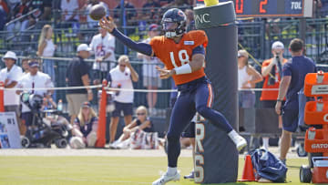 Caleb Williams whips the ball out to a receiver during passing drills at Bears training camp. His over/under for passing yards this year is 3,475.5 yards.