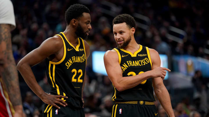 Golden State Warriors guard Stephen Curry (30) talks with forward Andrew Wiggins (22) during a break in the action against the New Orleans Pelicans in the second quarter at the Chase Center. Mandatory Credit: