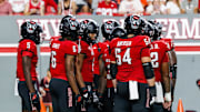 Sep 27, 2025; Raleigh, North Carolina, USA;  North Carolina State Wolfpack huddle during the first half of the game against Virginia Tech Hokies at Carter-Finley Stadium. Mandatory Credit: Jaylynn Nash-Imagn Images