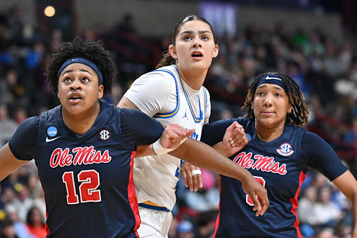 UCLA Bruins center Lauren Betts fights for position against Ole Miss forward Christeen Iwuala and guard Kennedy Todd-Williams