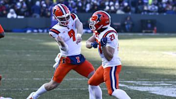 Nov 30, 2024; Chicago, Illinois, USA;  Illinois Fighting Illini running back Aidan Laughery (21) celebrates with quarterback Luke Altmyer (9) after scoring a touchdown against the Northwestern Wildcats.