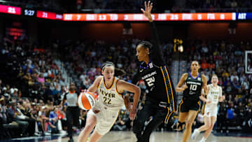 May 14, 2024; Uncasville, Connecticut, USA; Indiana Fever guard Caitlin Clark (22) drives the ball against Connecticut Sun forward DeWanna Bonner (24) in the first quarter at Mohegan Sun Arena. Mandatory Credit: David Butler II-Imagn Images