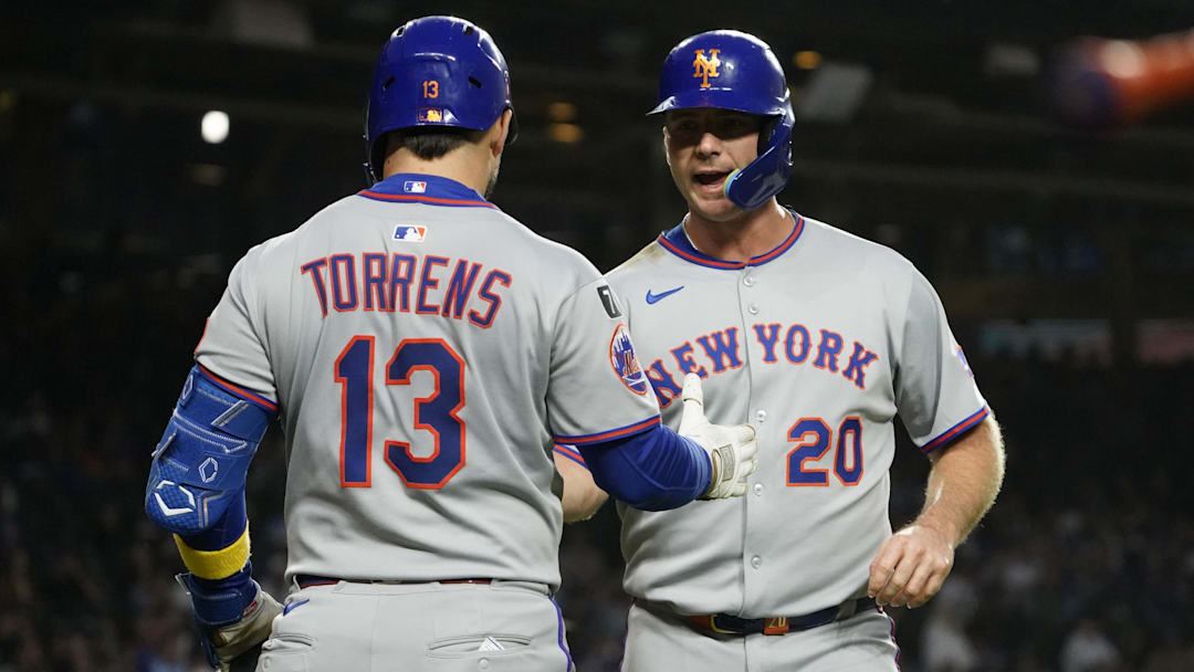 Sep 25, 2025; Chicago, Illinois, USA; New York Mets first base Pete Alonso (20) is greeted by catcher Luis Torrens (13) after scoring against the Chicago Cubs during the first inning at Wrigley Field. Mandatory Credit: David Banks-Imagn Images