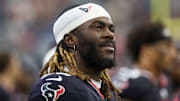 Aug 16, 2025; Houston, Texas, USA; Houston Texans defensive end Darrell Taylor (52) watches the Carolina Panthers play against the Texans in the second half at NRG Stadium. Mandatory Credit: Thomas Shea-Imagn Images