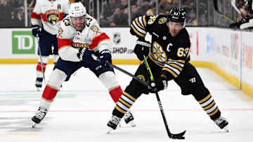 Oct 30, 2023; Boston, Massachusetts, USA; Boston Bruins left wing Brad Marchand (63) skates against Florida Panthers center Carter Verhaeghe (23) during the third period at the TD Garden. Mandatory Credit: Brian Fluharty-Imagn Images