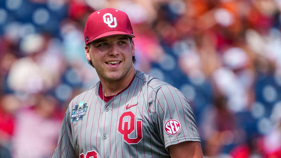 Oklahoma Sooners starting pitcher Cord Rager smiles after striking out another Alabama hitter. Oklahoma Sooners starting pitcher Cord Rager smiles after striking out another Alabama hitter.