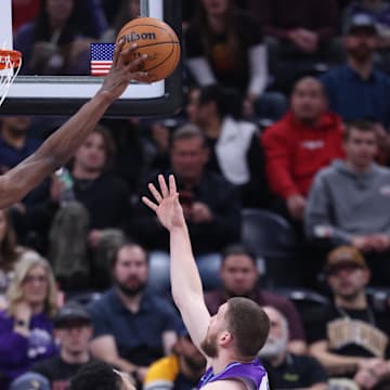 Feb 24, 2025; Salt Lake City, Utah, USA; Portland Trail Blazers forward Jerami Grant (9) blocks the shot of Utah Jazz guard Svi Mykhailiuk (19) during the second half at Delta Center. Mandatory Credit: Rob Gray-Imagn Images