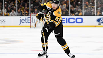 Nov 3, 2024; Boston, Massachusetts, USA; Boston Bruins defenseman Nikita Zadorov (91) takes a shot against the Seattle Kraken during the first period at the TD Garden. Mandatory Credit: Brian Fluharty-Imagn Images