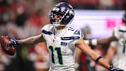 Dec 7, 2025; Atlanta, Georgia, USA; Seattle Seahawks wide receiver Jaxon Smith-Njigba (11) celebrates after a touchdown catch against the Atlanta Falcons in the fourth quarter at Mercedes-Benz Stadium. Mandatory Credit: Brett Davis-Imagn Images