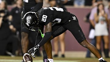Oct 26, 2024; College Station, Texas, USA; Texas A&M Aggies defensive back BJ Mayes (20) reacts after catching the ball for an interception in the third quarter against the LSU Tigers at Kyle Field. Mandatory Credit: Maria Lysaker-Imagn Images. 