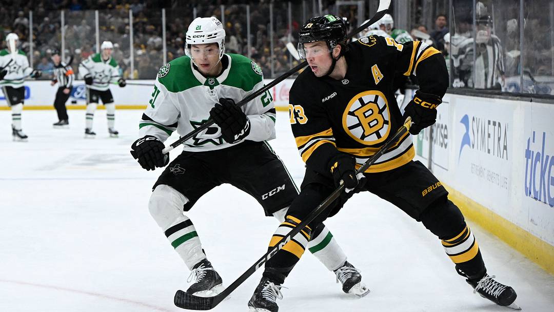 Mar 31, 2026; Boston, Massachusetts, USA; Boston Bruins defenseman Charlie McAvoy (73) passes the puck in front of Dallas Stars left wing Jason Robertson (21) during the second period at the TD Garden. Mandatory Credit: Brian Fluharty-Imagn Images Mar 31, 2026; Boston, Massachusetts, USA; Boston Bruins defenseman Charlie McAvoy (73) passes the puck in front of Dallas Stars left wing Jason Robertson (21) during the second period at the TD Garden. Mandatory Credit: Brian Fluharty-Imagn Images