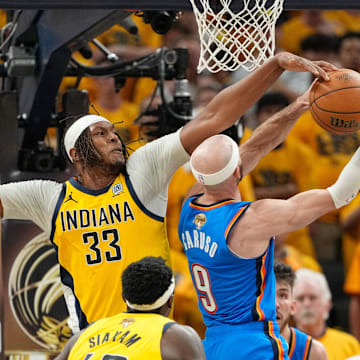 Jun 19, 2025; Indianapolis, Indiana, USA; Indiana Pacers center Myles Turner (33) blocks a shot by Oklahoma City Thunder guard Alex Caruso (9) in the third quarter during game six of the 2025 NBA Finals at Gainbridge Fieldhouse. Mandatory Credit: Kyle Terada-Imagn Images