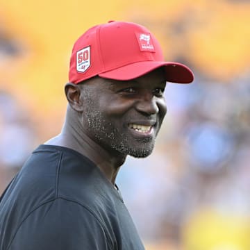 Aug 16, 2025; Pittsburgh, Pennsylvania, USA; TTampa Bay Buccaneers head coach Todd Bowles () warms up for a game against the Pittsburgh Steelers at Acrisure Stadium. Mandatory Credit: Barry Reeger-Imagn Images