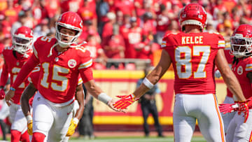 Sep 15, 2024; Kansas City, Missouri, USA; Kansas City Chiefs quarterback Patrick Mahomes (15) greets tight end Travis Kelce (87) during player introductions against the Cincinnati Bengals prior to a game at GEHA Field at Arrowhead Stadium. Mandatory Credit: Denny Medley-Imagn Images