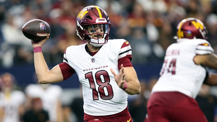 Jan 5, 2025; Arlington, Texas, USA; Washington Commanders quarterback Marcus Mariota (18) throws a pass against the Dallas Cowboys during the third quarter at AT&T Stadium. Mandatory Credit: Tim Heitman-Imagn Images