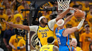 Jun 19, 2025; Indianapolis, Indiana, USA; Indiana Pacers center Myles Turner (33) blocks a shot by Oklahoma City Thunder guard Alex Caruso (9) in the third quarter during game six of the 2025 NBA Finals at Gainbridge Fieldhouse. Mandatory Credit: Kyle Terada-Imagn Images