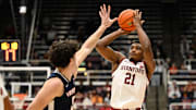 Jan 11, 2025; Stanford, California, USA; Stanford Cardinal guard Jaylen Blakes (21) shoots a three point basket over Virginia Cavaliers forward Blake Buchanan (0) in the second half at Maples Pavilion. Mandatory Credit: Eakin Howard-Imagn Images