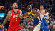 Golden State Warriors forward Draymond Green battles for position with Houston Rockets center Steven Adams.