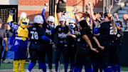 The Oklahoma City Spark's Jocelyn Alo is greeted at home by teammates after celebrates a home run during a softball against the Florida Vibe at Oklahoma Christian University in Edmond, Okla., Tuesday, July 22, 2025.