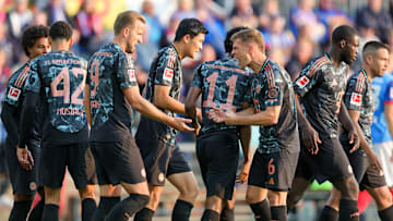 Bayern Munich players celebrating goal against Holstein Kiel.