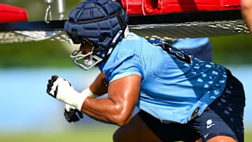 Jul 24, 2025; Nashville, TN, USA;  Tennessee Titans offensive tackle JC Latham (55) goes through drills during training camp at Ascension Saint Thomas Sports Park. Mandatory Credit: Steve Roberts-Imagn Images