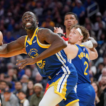 Apr 6, 2025; San Francisco, California, USA; Golden State Warriors forward Draymond Green (23) battles for position with Houston Rockets center Steven Adams (12) in the fourth quarter at the Chase Center. Mandatory Credit: Cary Edmondson-Imagn Images