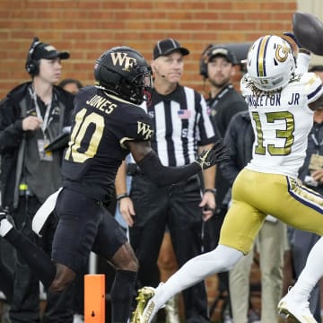 Sep 23, 2023; Winston-Salem, North Carolina, USA;  Georgia Tech Yellow Jackets wide receiver Eric Singleton Jr. (13) makes a touchdown catch during the first half against the Wake Forest Demon Deacons at Allegacy Federal Credit Union Stadium. Mandatory Credit: Jim Dedmon-USA TODAY Sports