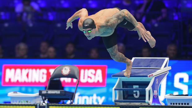 Caeleb Dressel dives into the pool in the 50-meter freestyle final.