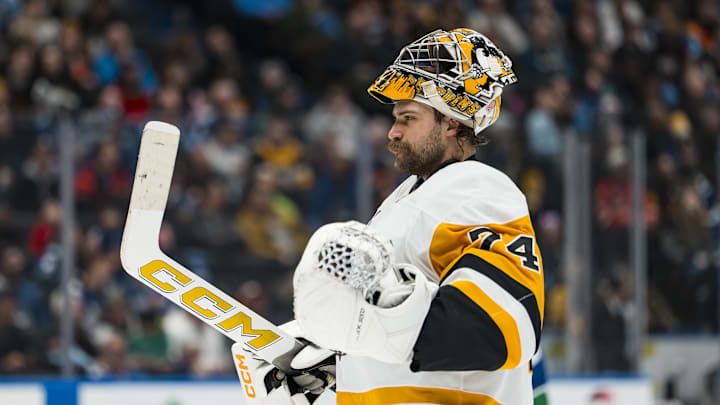 Pittsburgh Penguins goalie Stuart Skinner (74) during a stop in play against the Vancouver Canucks in the second period at Rogers Arena. Mandatory Credit: Bob Frid-Imagn Images