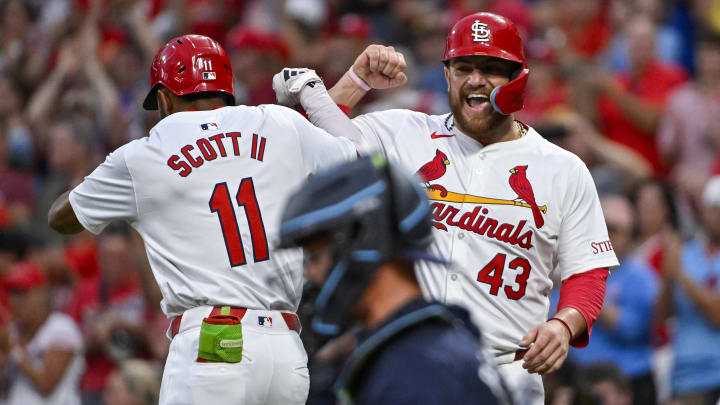 Aug 6, 2024; St. Louis, Missouri, USA;  St. Louis Cardinals center fielder Victor Scott II (11) celebrates with catcher Pedro Pages (43) after hitting a two run home run against the Tampa Bay Rays during the second inning at Busch Stadium. Mandatory Credit: Jeff Curry-USA TODAY Sports