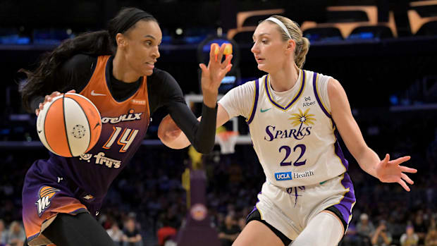 A photo of DeWanna Bonner being defended by Cameron Brin