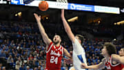 Nebraska guard Rollie Worster scores against Creighton center Ryan Kalkbrenner last season in Omaha.